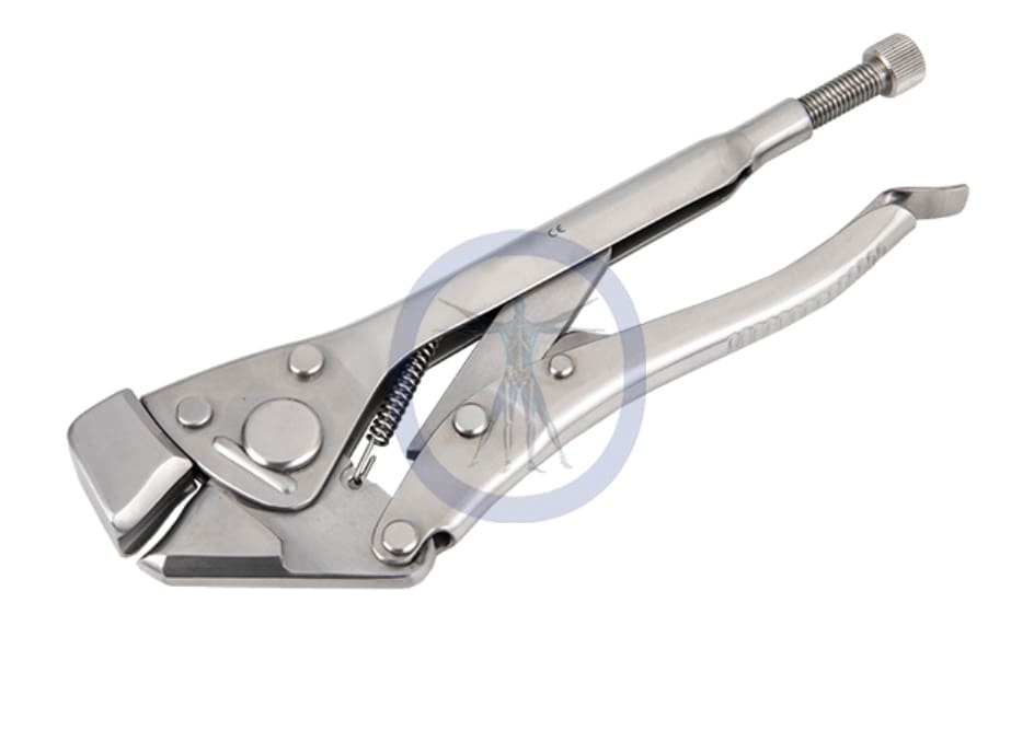 A pair of pliers with a wrench on top.