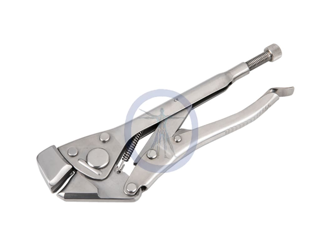 A pair of metal tools with a wrench on top.