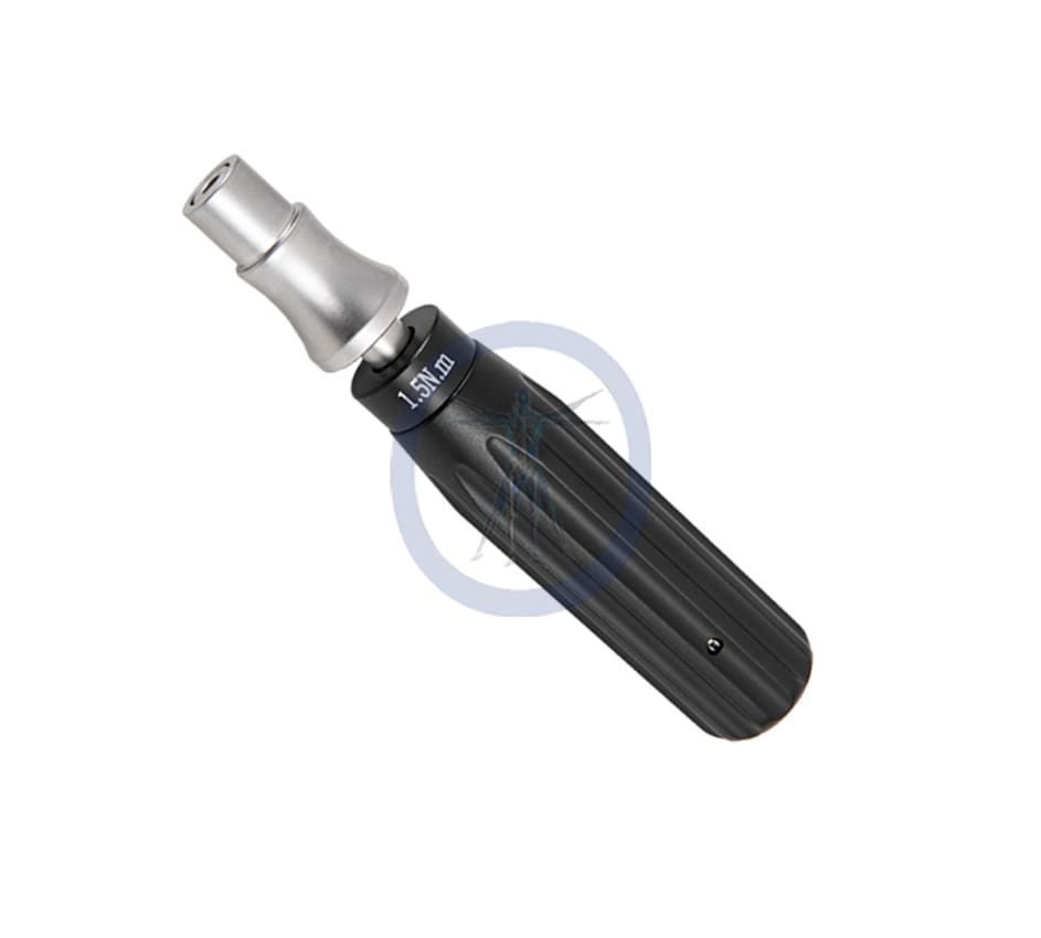 A black and silver screwdriver is laying on the ground.