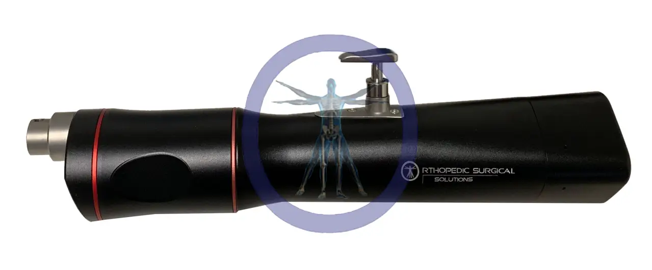 Black and red surgical drill on white background.