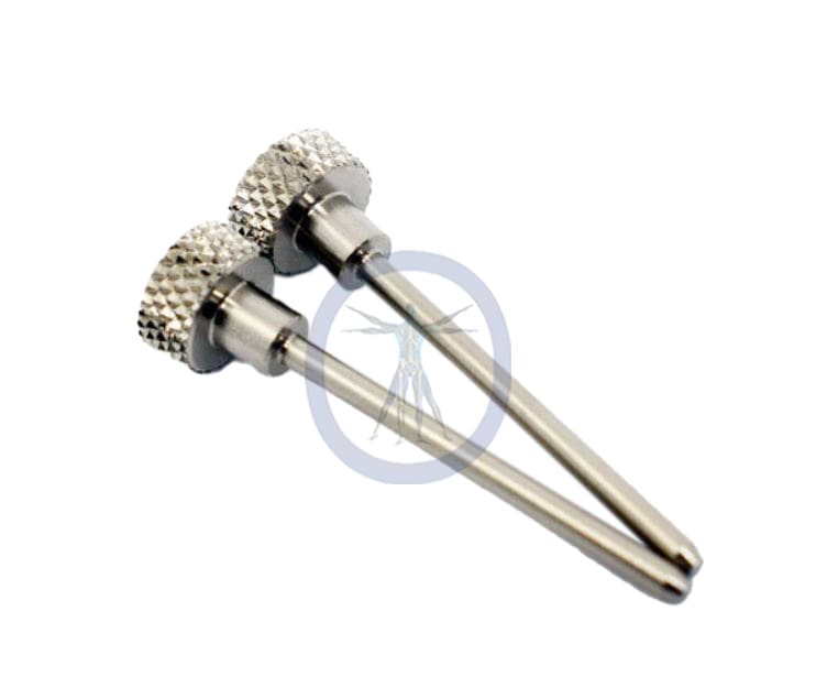 A pair of metal handles with a diamond pattern on them.