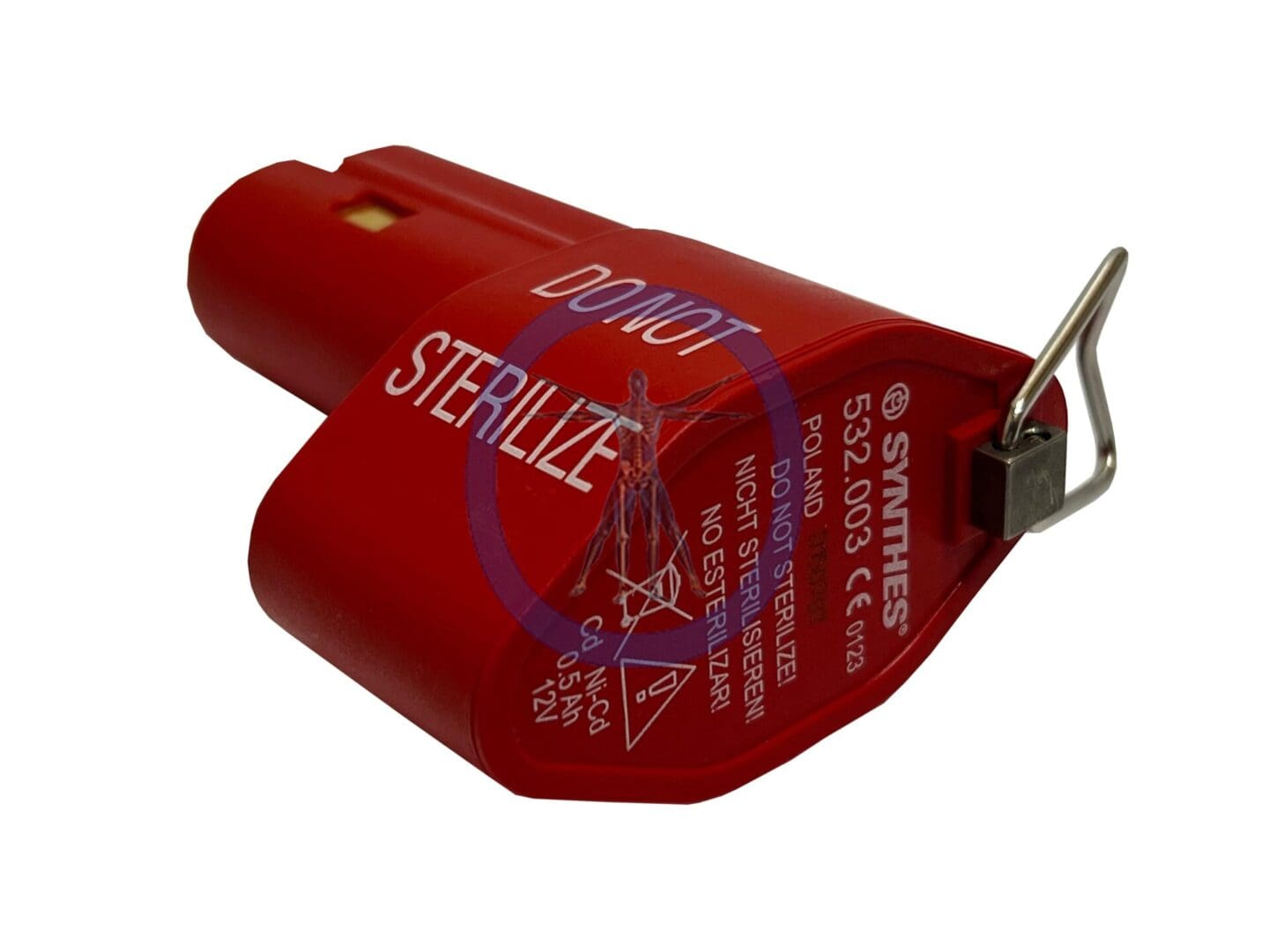 A red sterile container with a metal clip attached to it.