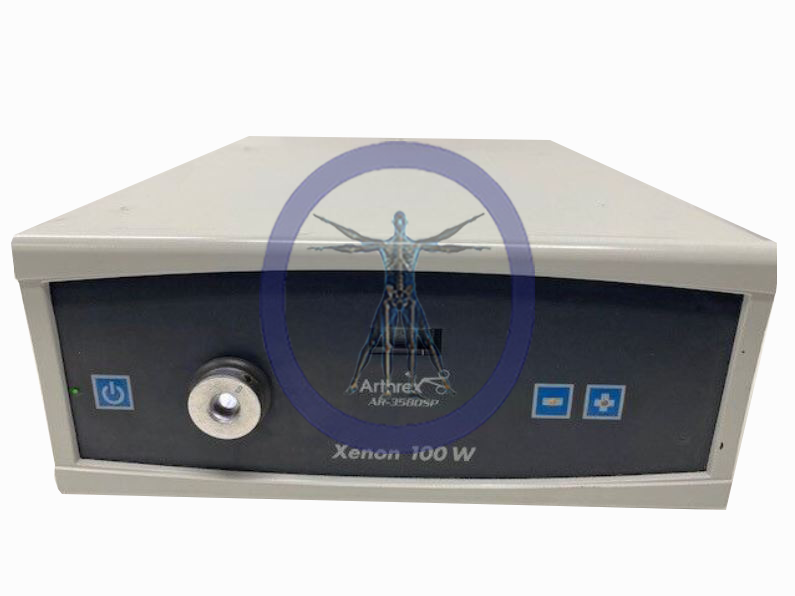 A medical device labeled "Arthrex AR-3580SP Light Source" with an illuminated blue power icon button and additional control symbols on the front panel.