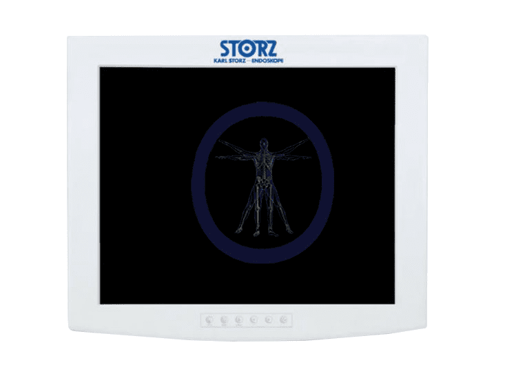 A KarlStorz-SC-SX19-A1A11 19" HD Flat Panel Monitor displaying an x-ray image of a human skeleton in standing position, encircled by a blue outline, on a black background.