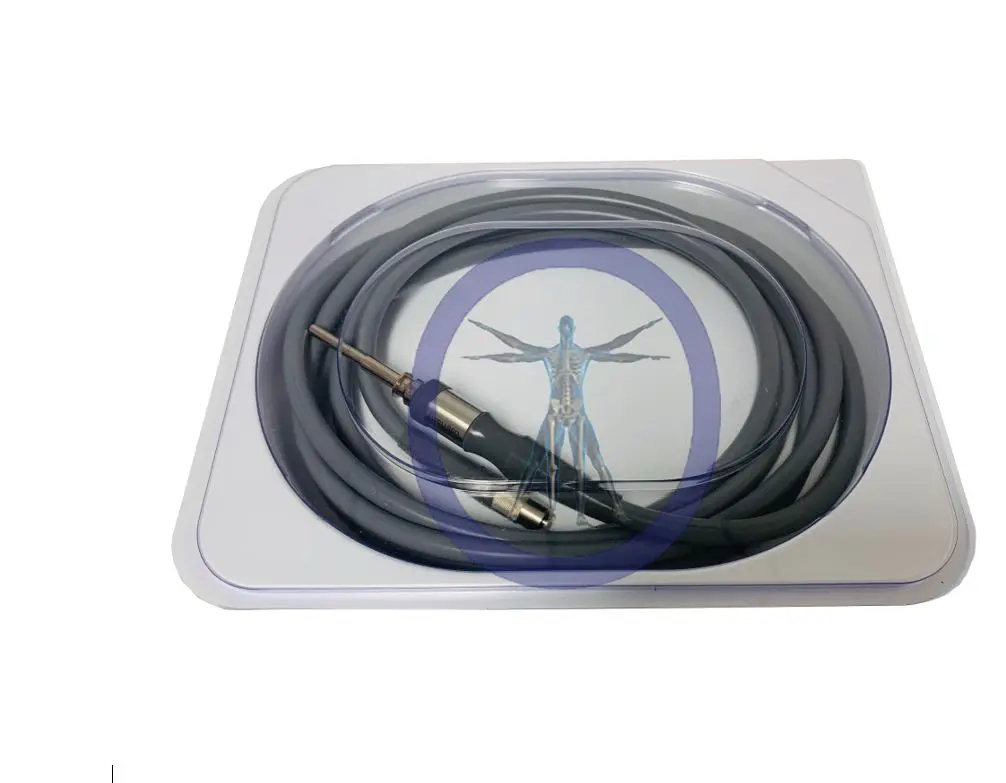 An Orthopedic Surgical Solutions 11011 Karl Storz Compatible Light Source Cable coiled in a transparent plastic package with a blue and silver design featuring the vitruvian man illustration.