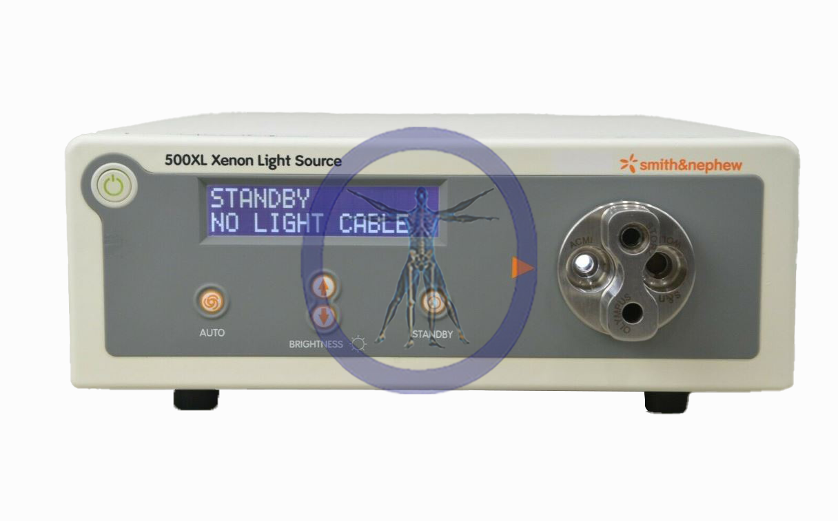 Front view of a Smith & Nephew 500XL Light Source medical device with a standby indicator, brightness settings, and cable ports.