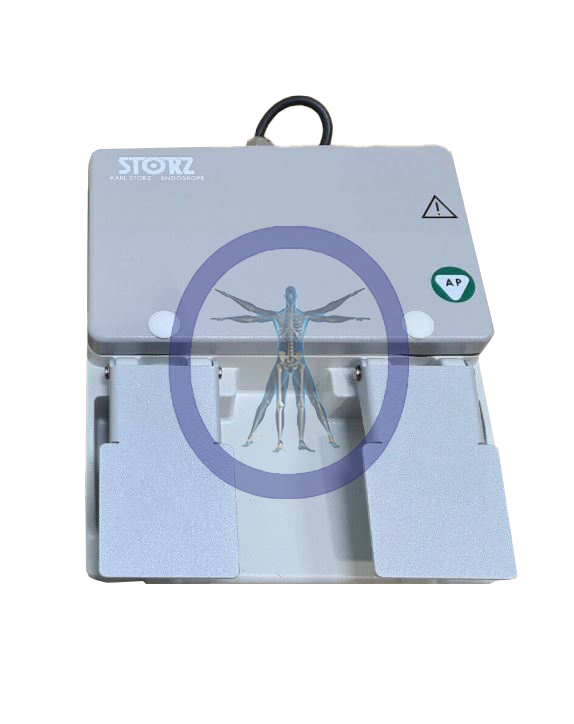 A Karl Storz 20011430 Two Pedal Foot Switch with an anatomical human graphic on the front, isolated on a white background.