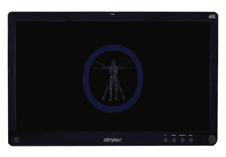 Monitor displaying a digital image of a human skeleton within a blue circle, labeled "Stryker-240-031-050 4K" on its frame.
