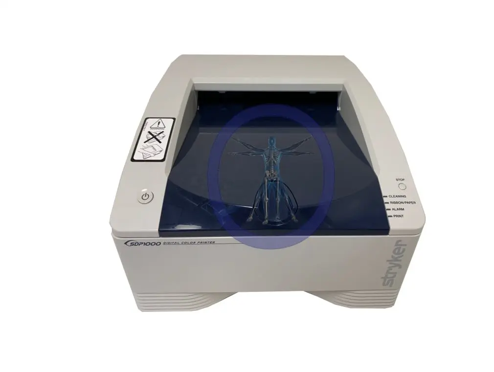 A medical imaging printer with a blue light.
