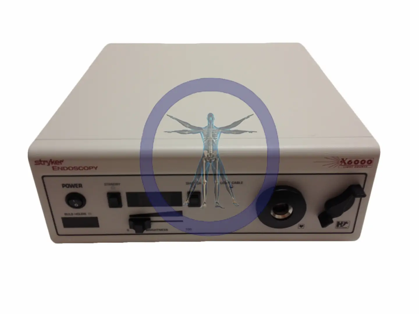 Medical endoscopy device marked "Stryker X6000 Light Source" with various control buttons and ports, featuring a graphic of a human body overlaid in blue.