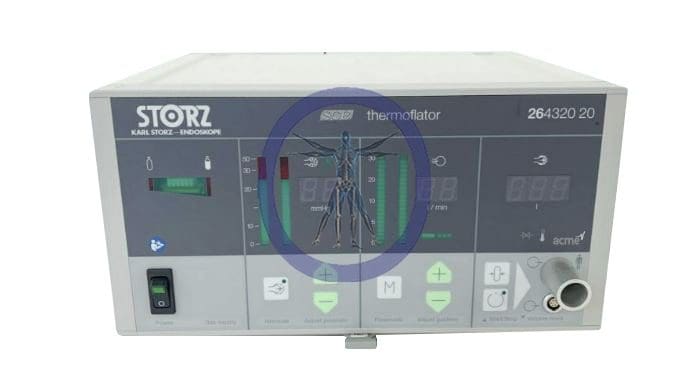 Medical equipment labeled "KarlStorz 26432020" with digital displays and control buttons, used for insufflating gas during surgical procedures.